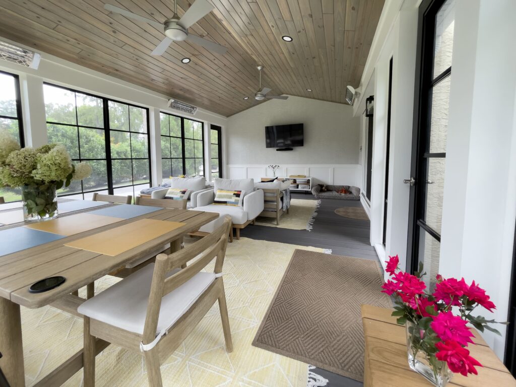 Gorgeous interior of sunroom with wall of windows