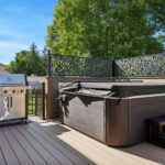 Sunroom with deck and jacuzzi