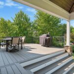 Deck with table and chairs with barbecue