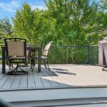 Deck with table and chairs with barbecue