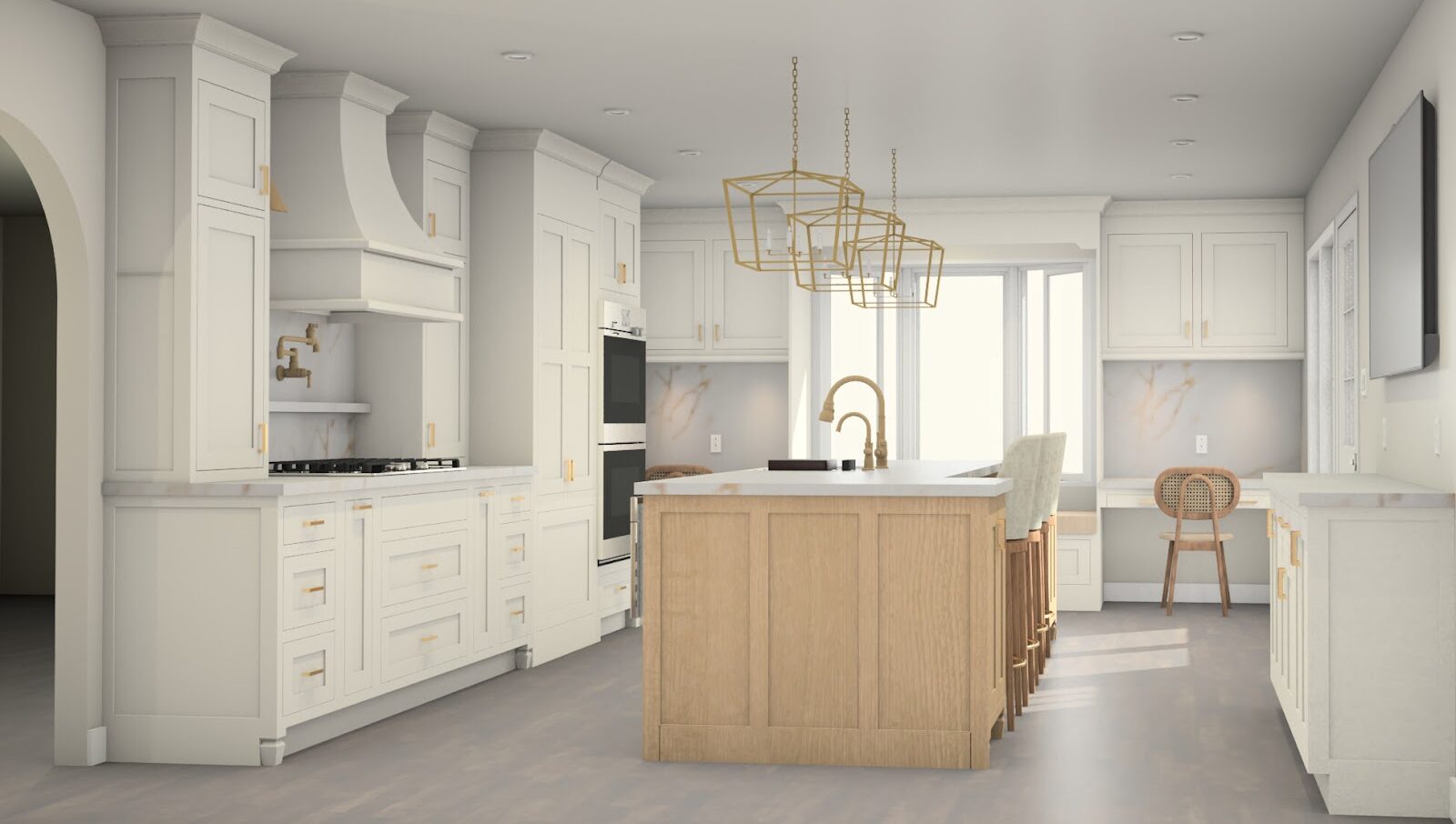 A spacious, modern kitchen with white cabinets, gold hardware, a large wooden island, gold pendant lights, built-in appliances, and a small desk area near a window. Light wood floors and neutral tones create an airy feel.