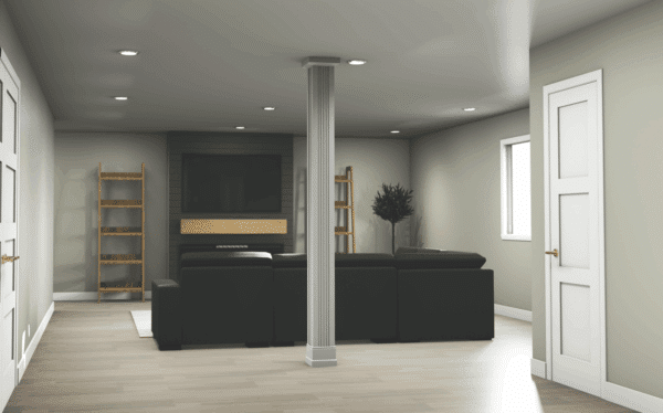 A modern living room with light gray walls, wood flooring, a dark sectional sofa facing a wall-mounted TV, built-in shelves on either side, a central column, and a white door to the right.