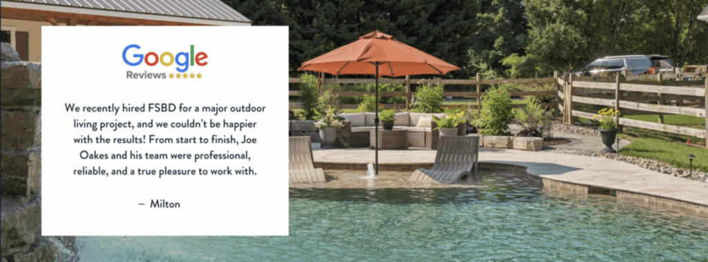 A landscaped backyard features a pool with a curved stone edge, an umbrella shading patio furniture, lush greenery, and a wooden fence. Overlaid is a Google review praising FSBD for excellent outdoor project work.